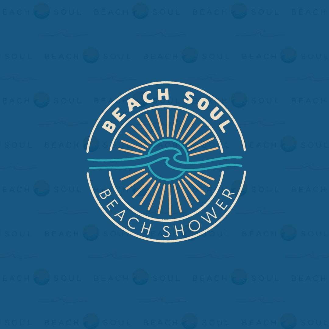 A circular Beach Soul Beach Shower logo featuring white text, a light blue wave, and a light orange sun with rays on a dark blue background