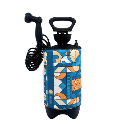 Portable shower featuring a blue and orange geometric pattern sleeve, black coiled hose, pump handle, and a vertical PORTABLE SHOWER label