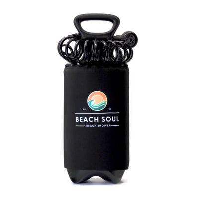 Product photograph of a black Beach Soul portable beach shower with a top handle and coiled black hose, prominently displaying its circular orange sun and blue wave logo