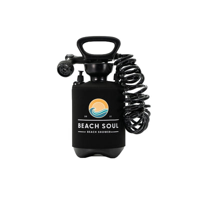 Black Beach Soul portable beach shower unit with a coiled hose, spray nozzle, and a branded neoprene sleeve displaying an orange sun and blue wave logo with the year 2021