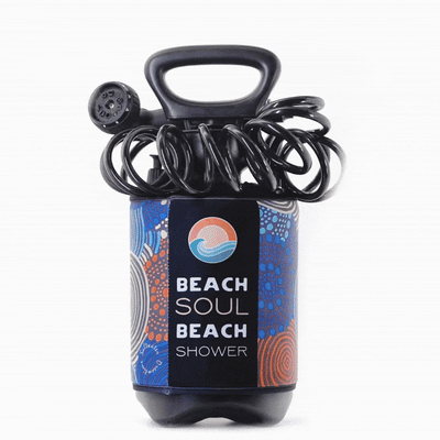 Black portable Beach Soul Beach Shower with a vibrant blue and orange Indigenous-inspired dot art pattern and coiled shower hose