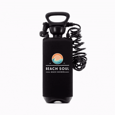 Black Beach Soul portable pressure shower with a top handle, coiled hose, and a colorful logo featuring an orange sun and blue wave
