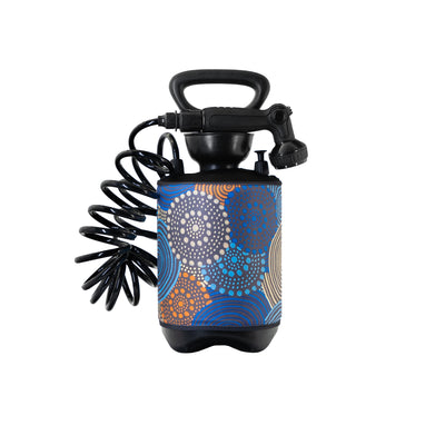 A product shot of a black portable pressure sprayer with a coiled hose and shower nozzle, featuring a colorful cylindrical body adorned with abstract dotted and swirled patterns in shades of blue, orange, and light grey