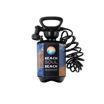 Portable Beach Soul Beach Shower with black handle and coiled hose, featuring a vibrant wrap with blue and orange dot patterns and a logo of a sun above waves