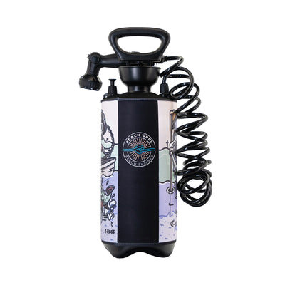Beach Soul portable shower with J Ross artwork, a black portable shower featuring an ergonomic handle and coiled hose, adorned with a custom lavender and teal graphic sleeve depicting colorful fish, waves, and palm trees, showcasing the Beach Soul logo