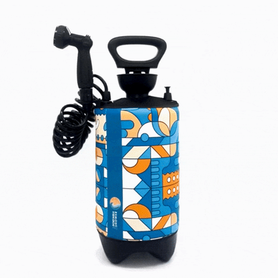 Portable shower unit featuring a vibrant blue and orange geometric abstract pattern, a black coiled hose, showerhead, and a vertical blue stripe with 'Portable Shower' text and a sun logo